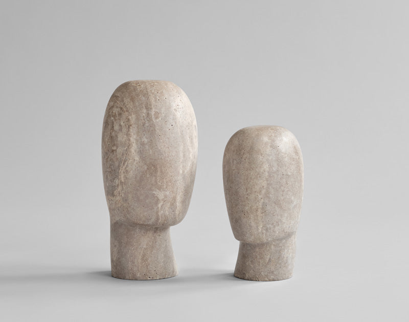 two calm sculptures in Silver Travertine, depicting abstract silhouettes of a neck and head. 