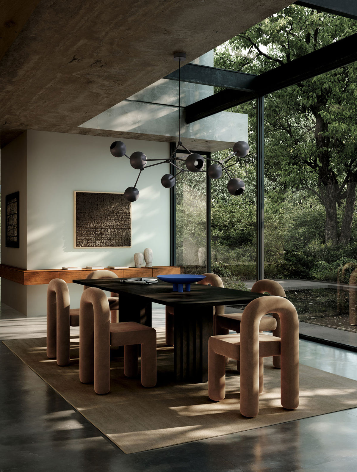 Dinning room with Ark table, Daiku dinning chairs in wool velvet in Desert, Drop chandelier bulb, Head sculptures, and Duck Tray in Marrakech Blue