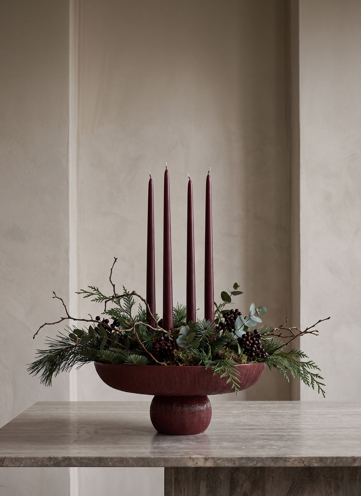 A Baburu Bowl in Carved Ruby with Christmas lighting decoration