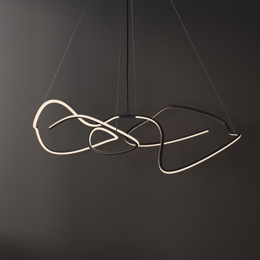 An abstract modern Ghost LED pendant light with intertwined curved tubes in black and white, suspended by thin cables against a dark gray background.