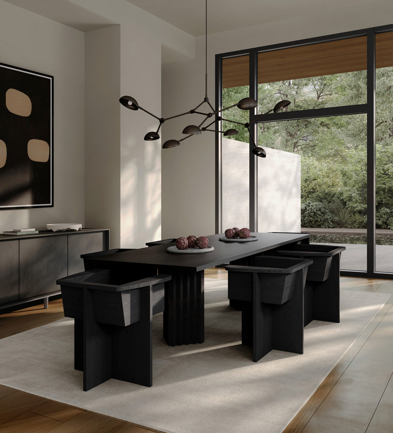 Modern dining room with Arc table and Brutus dining chairs in a bright room with large windows and a Drop Chandelier.