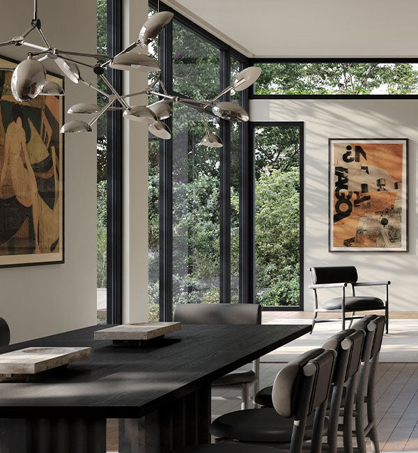 Drop Chandelier in Chrome over an Arc Dining table with Oka Trays  and Nama Lounge chairs