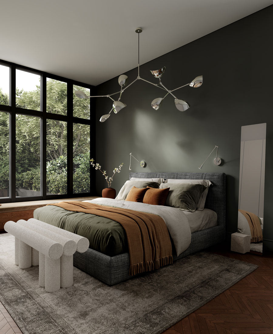 Modern bedroom with a bed, Hiro bench, Stingray chandelier and Snake wall lampsand large windows.